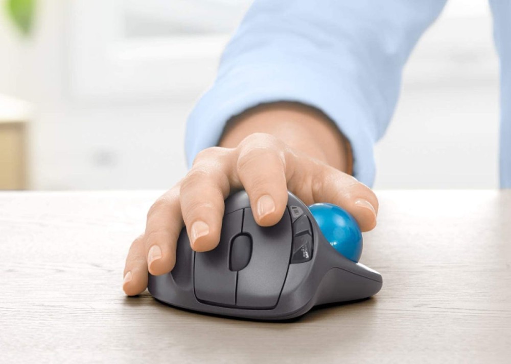 hand moving a wireless ergonomically designed laptop mouse