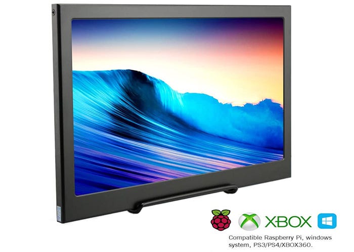 large dark gray display monitor showing a picture of an ocean wave at sunset