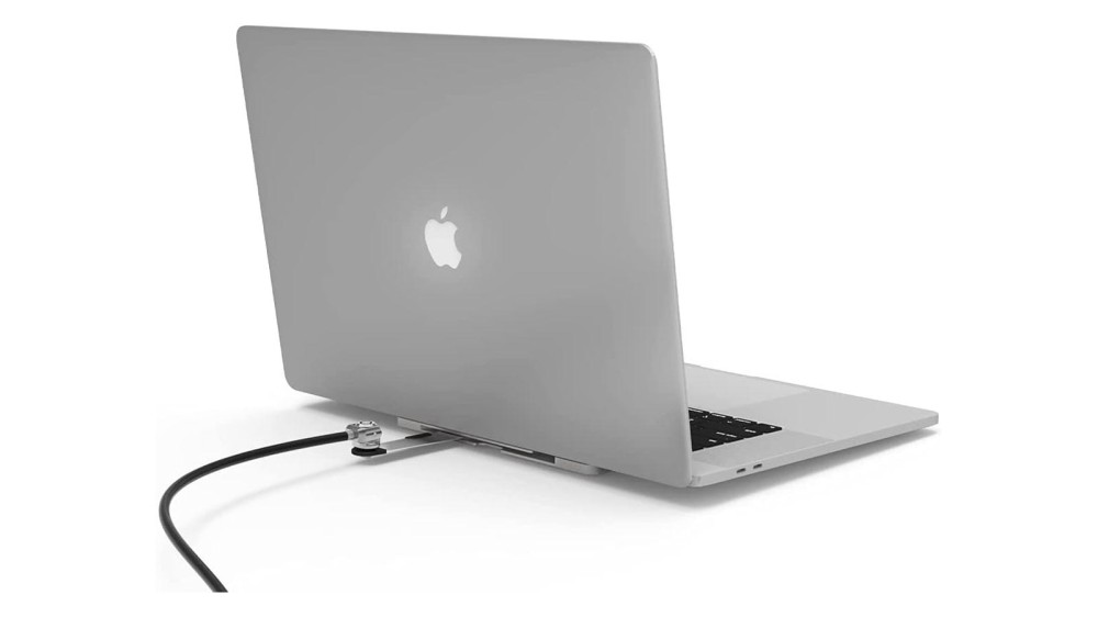 A rear view of a Mac laptop with a slot blade lock attached. 