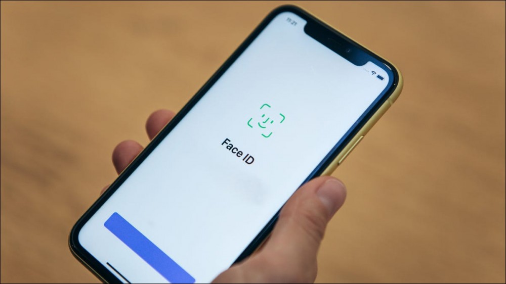 An iPhone 11 showing Face ID interface.