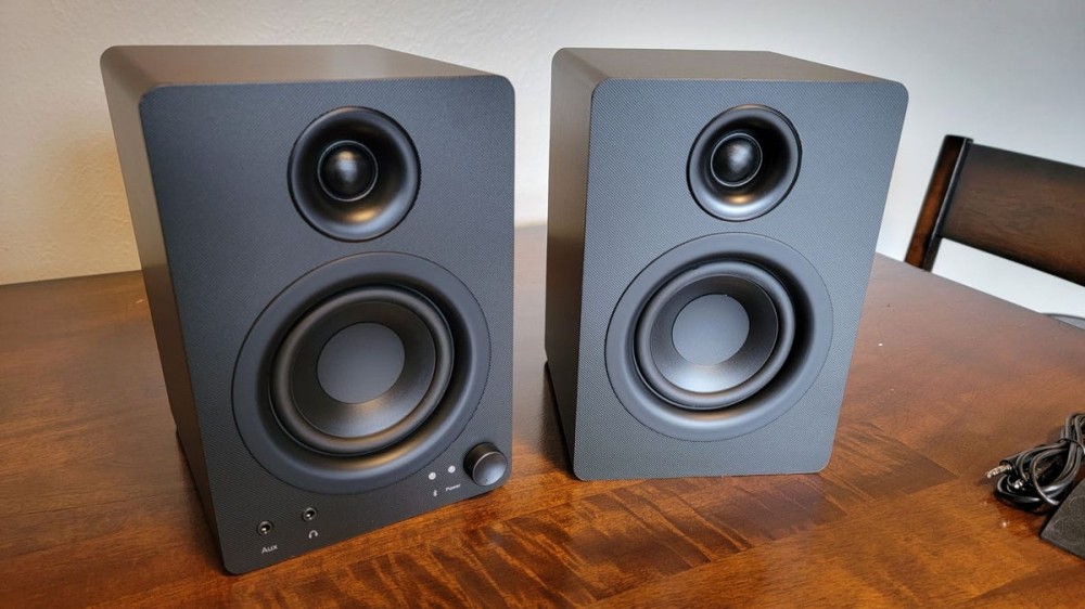 MonoPrice DT-3BT desktop speakers sitting on table