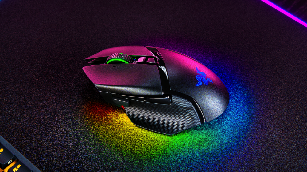 The Razer Basilisk V3 Pro on a mousepad with RGB lighting.