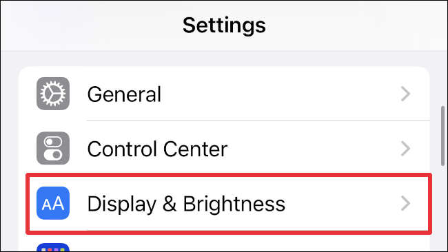 Select "Display & Brightness" in your iPhone's settings menu.