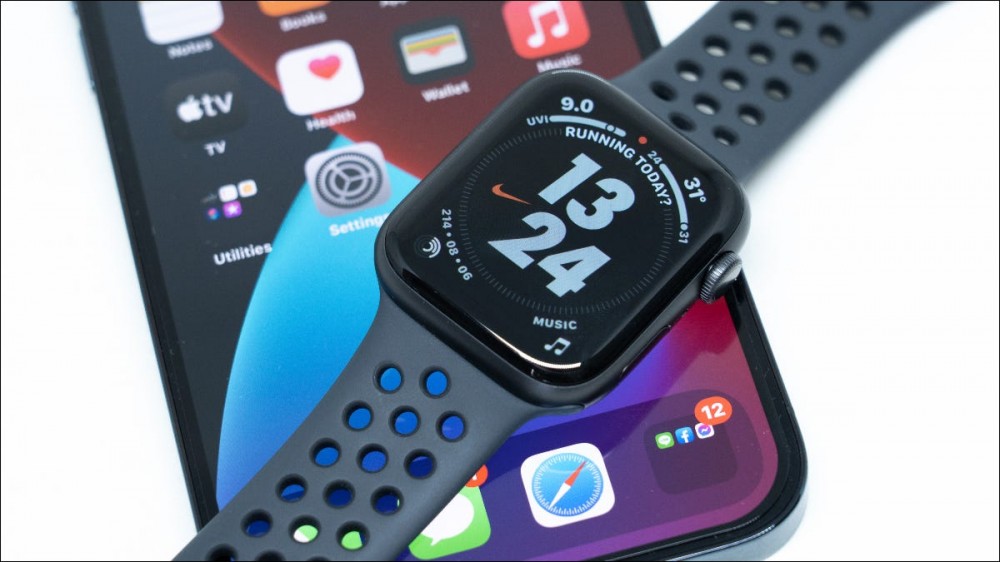 Apple Watch lying on top of an iPhone