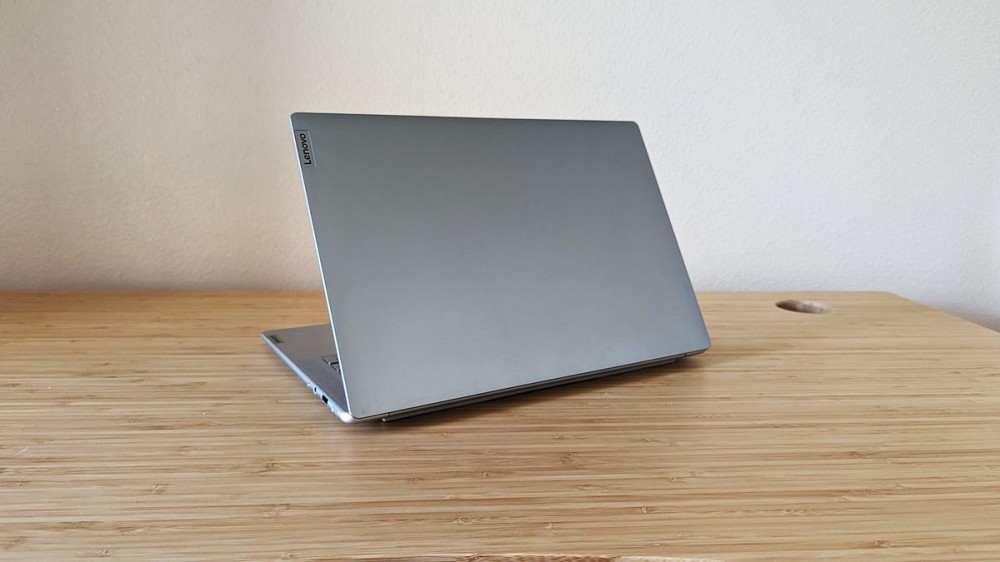 The Lenovo Slim 7i Pro X laptop sitting on a desk.