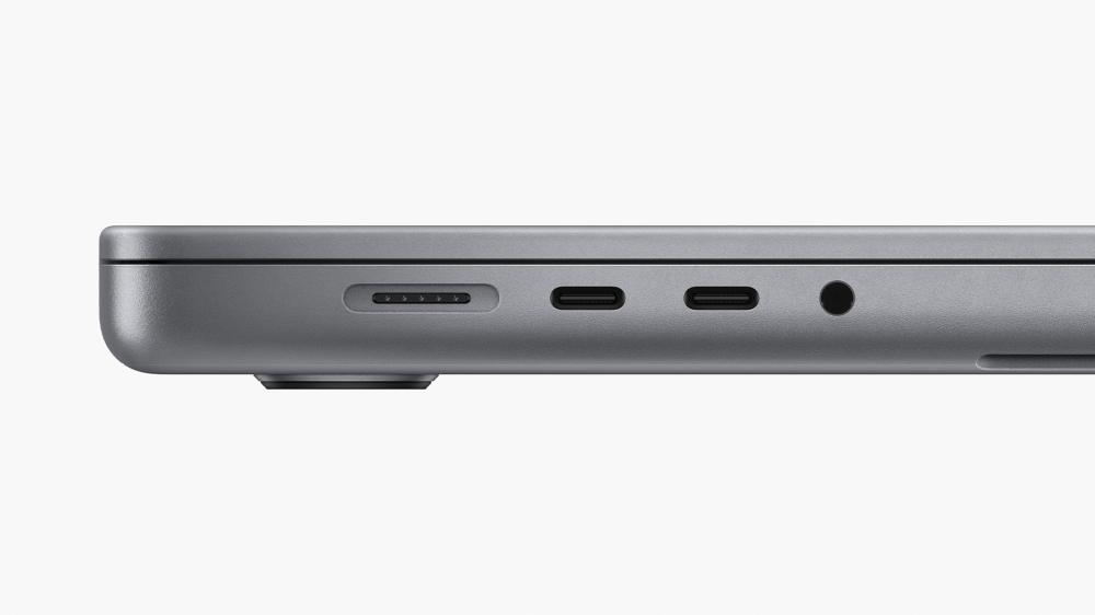 MacBook Pro's MagSafe charger, headphone jack, and two Thunderbolt ports (left side of machine).