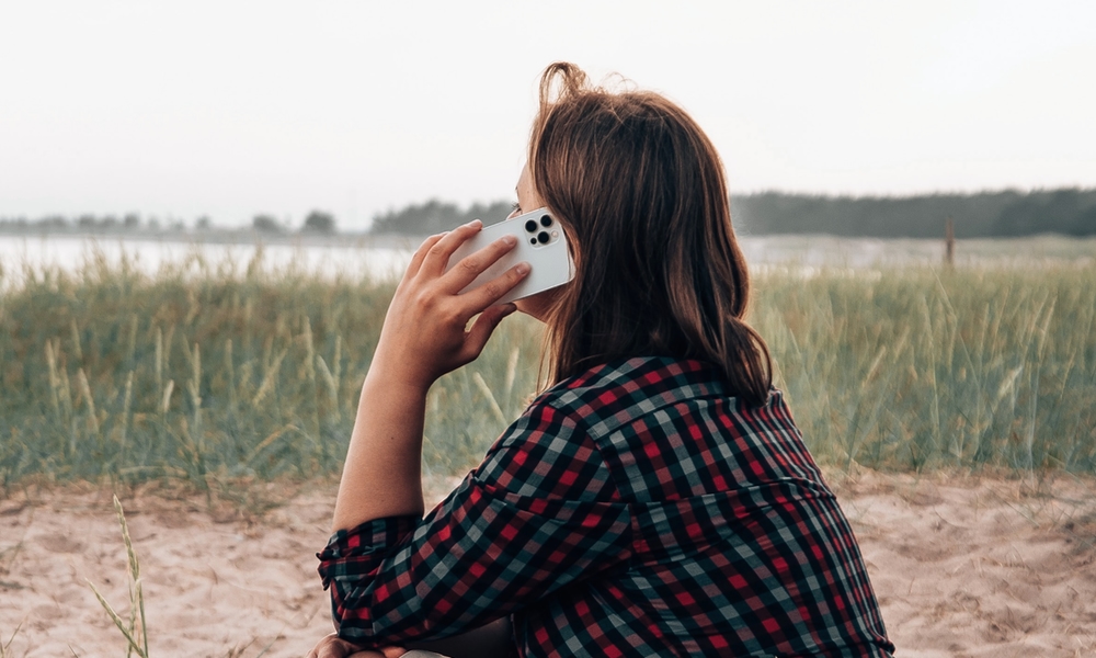 person talking on iPhone