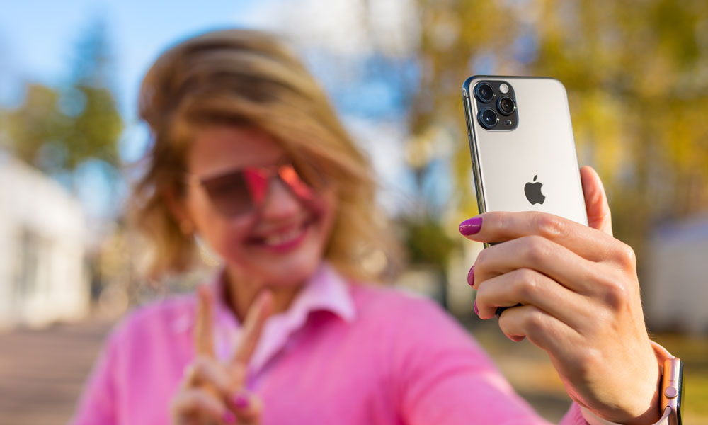 woman taking selfie with iPhone 11 Pro