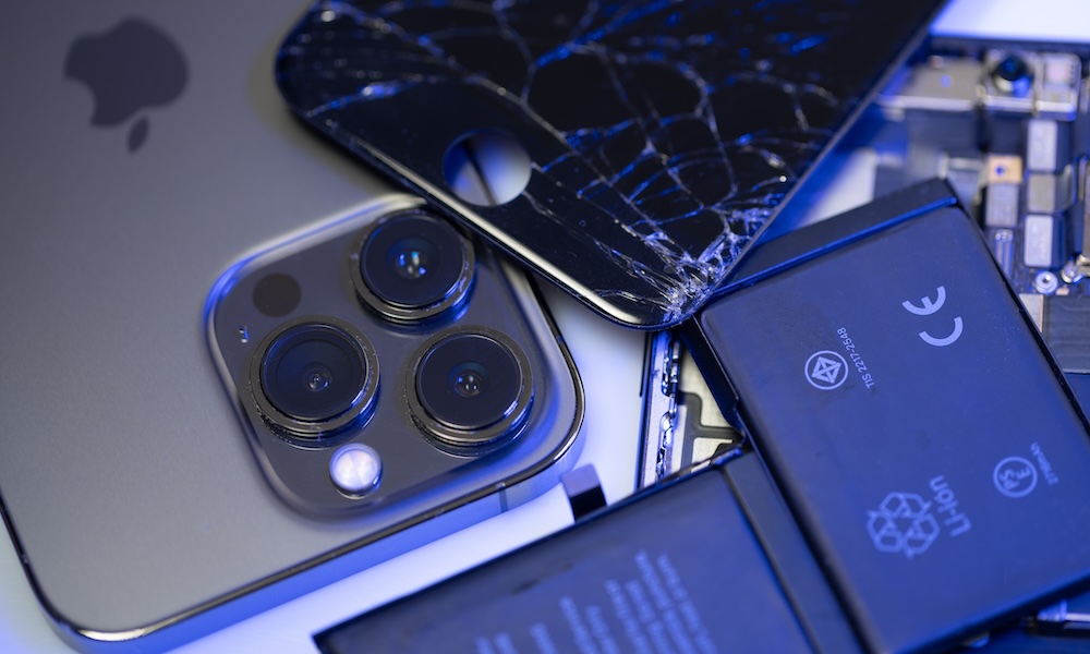 Broken iPhone display on top of new iPhone model. Replacement parts for Smartphone