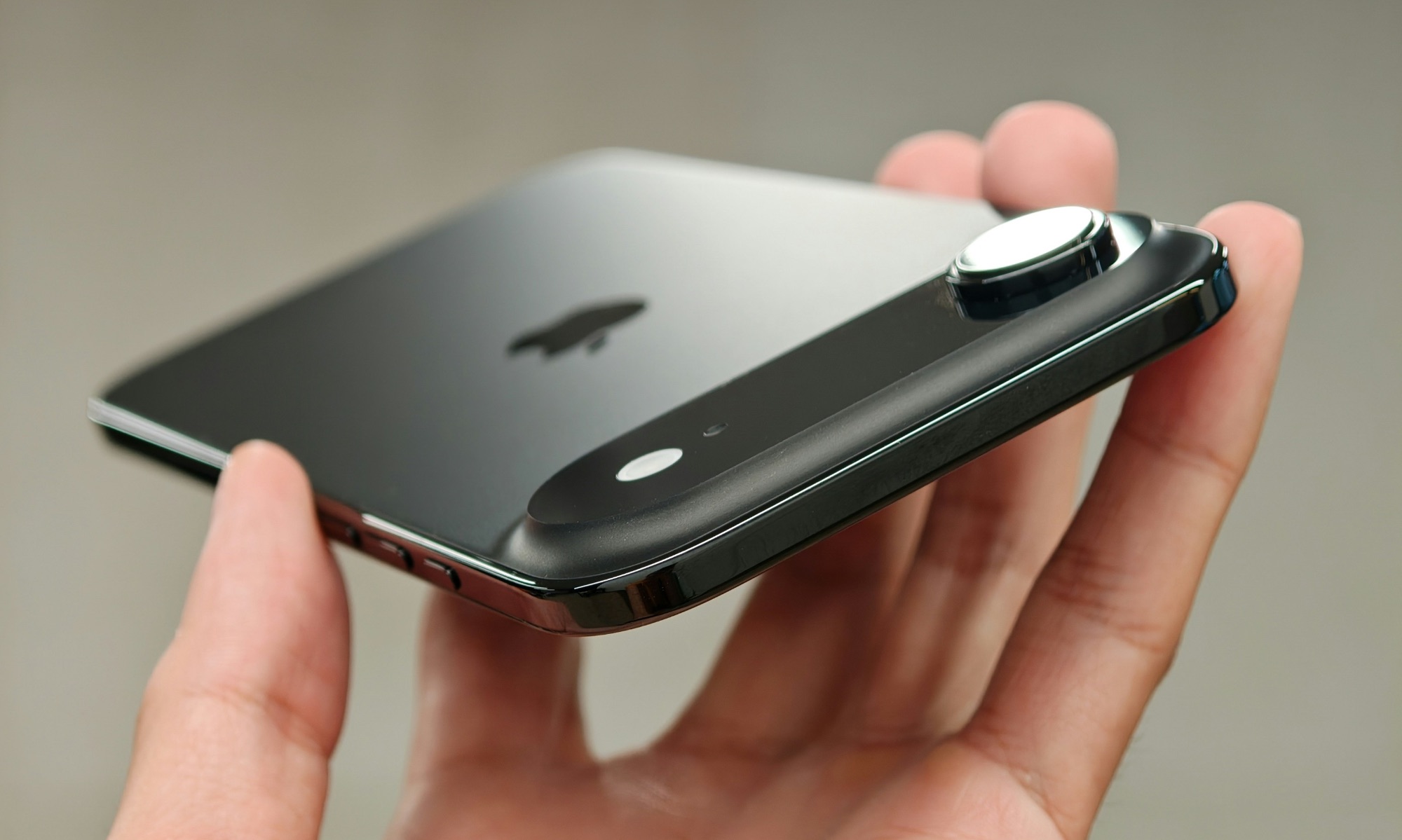 iPhone Air in hand top edge view